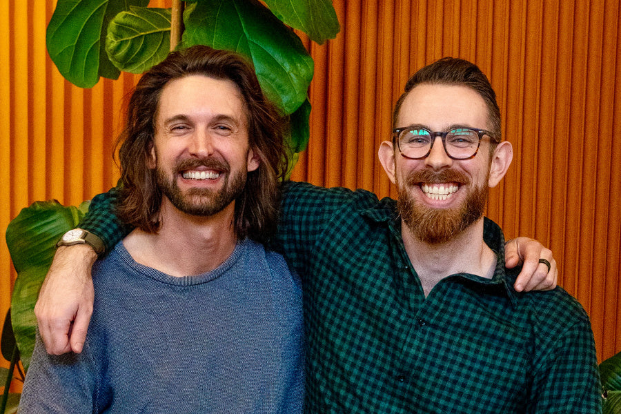 The two founders of FLUSTER with their arm around each other