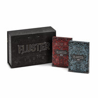 The FLUSTER game box with the Laugh Pack and Spicy Pack standing up next to it.